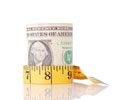 Roll of money with tap measurer around it