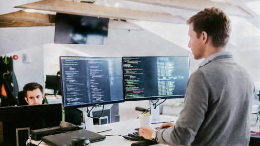 Developer programming on a computer